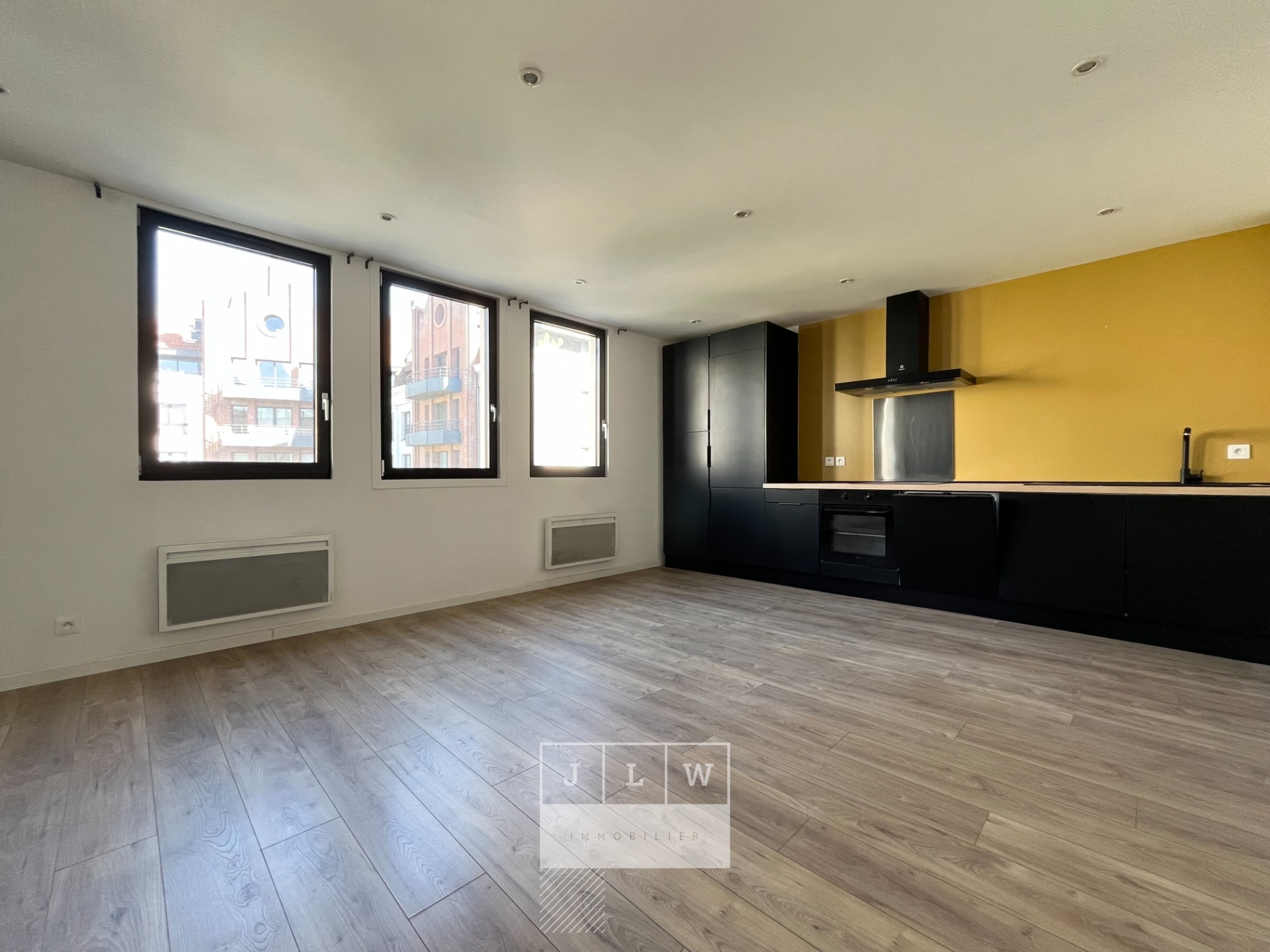 Appartement renove avec cave et parking Photo 1 - JLW Immobilier