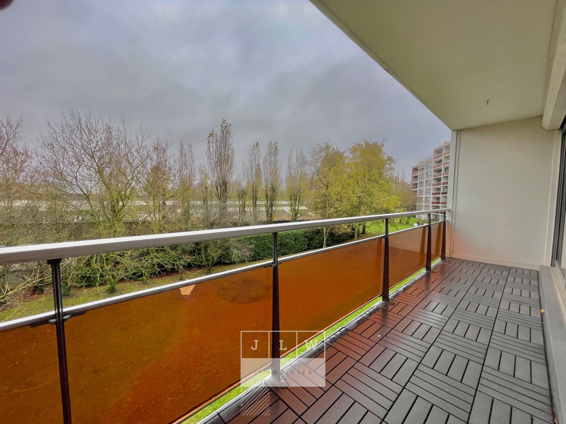 Bel appartement lumineux avec balcon cave et garage Photo 3 - JLW Immobilier