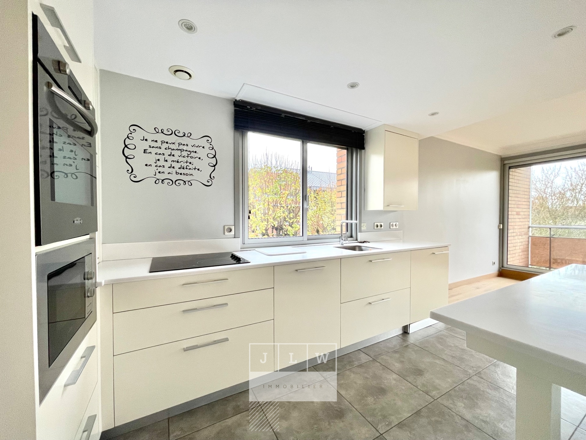 Bel appartement lumineux avec balcon cave et garage Photo 4 - JLW Immobilier