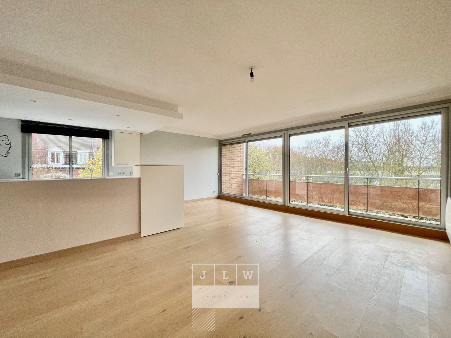 Bel appartement lumineux avec balcon cave et garage Photo 7 - JLW Immobilier